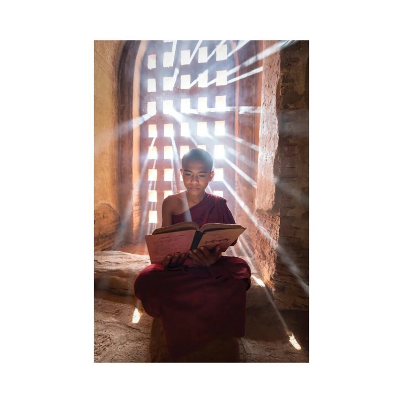 Burmese Novice Monk Reading A Book In A Temple, Bagan, Myanmar by Jan Becke - Wrapped Canvas Print, 20.32 cm H x 30.48 cm W