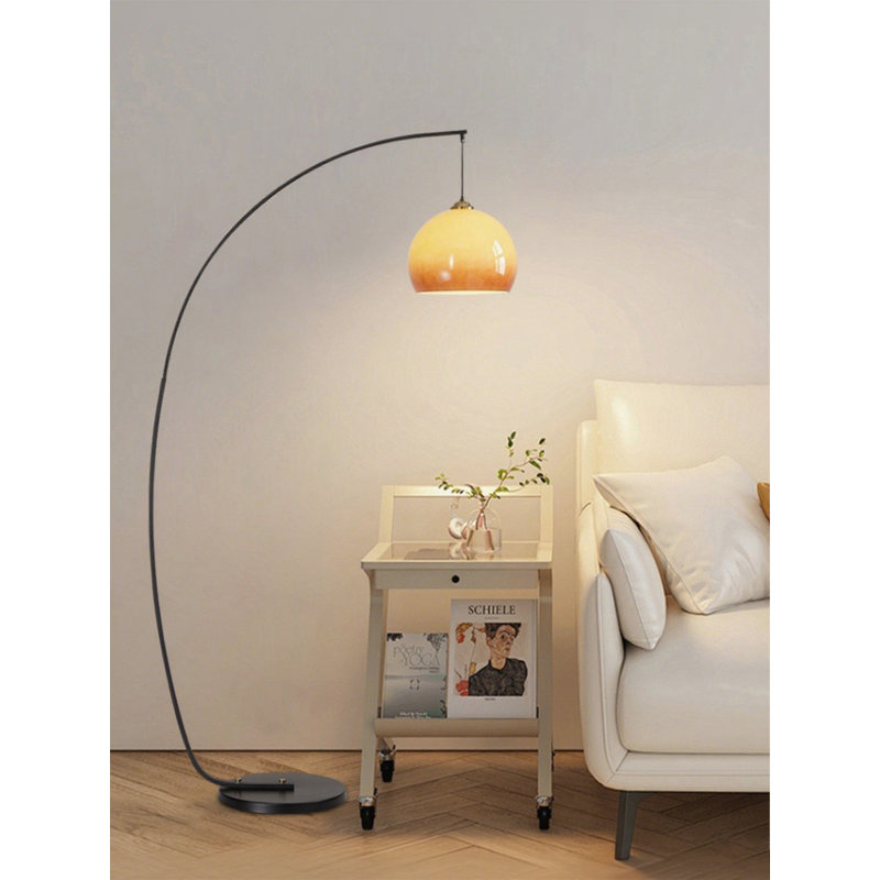 Mid-century modern style glass and wrought iron floor lamp.