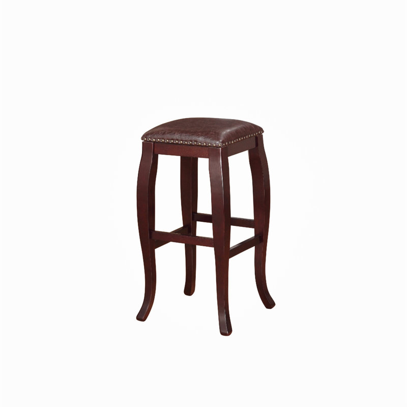 Tabouret en bois avec assise rembourrée et bordure cloutée