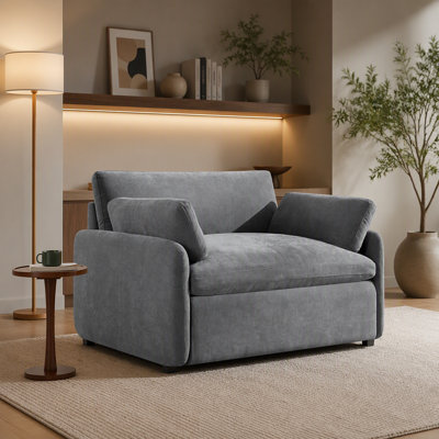 Fauteuil d'appoint rembourré surdimensionné en chenille avec assise profonde et coussins pour le confort d'un salon moderne