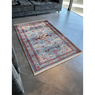 Tapis décoratif bleu à motif floral et animal