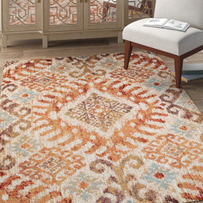 Tapis orange à motif géométrique Farwa