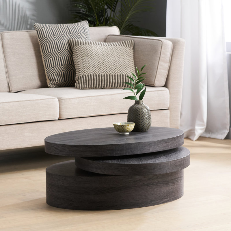 Table basse ovale noire rotative avec base et fonction pivotante moderne