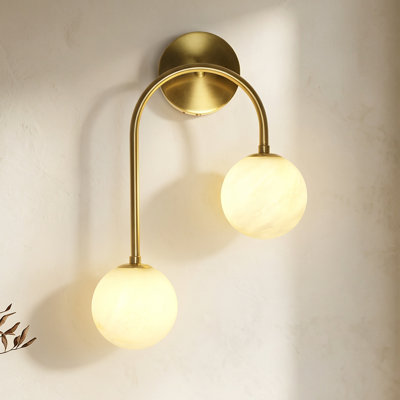 Modern 2-Light Globe Wall Sconce with Faux Alabaster Glass Shades and Brass Finish