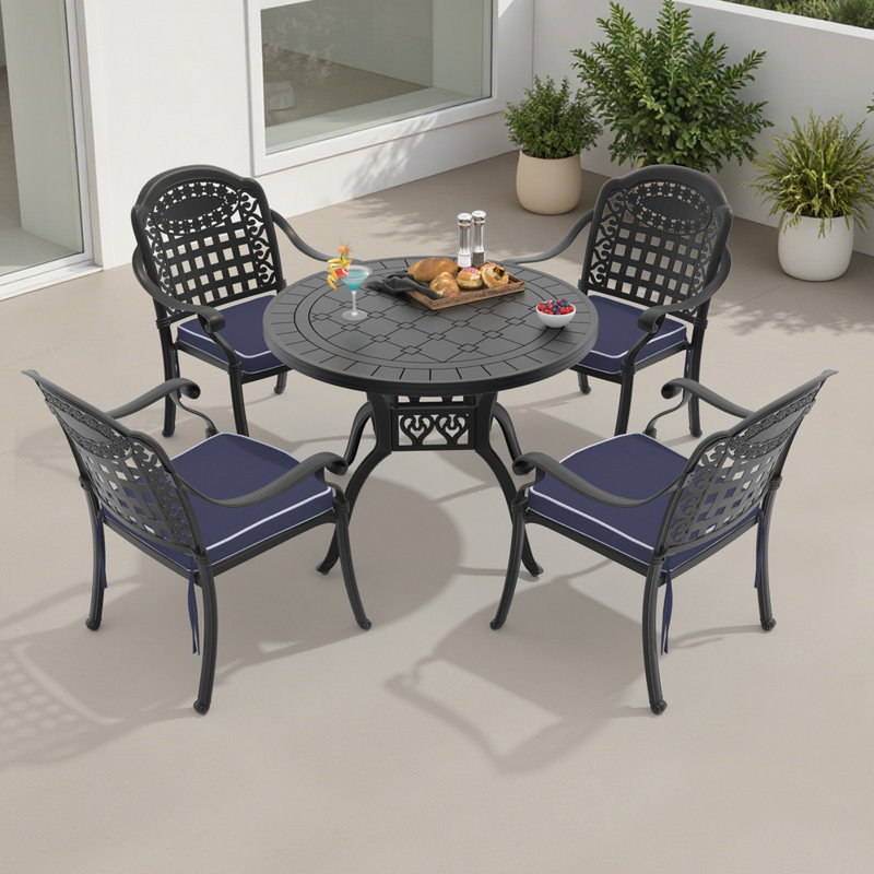 Reontae 4 - Person Patio Dining Set with Round Table , Cushions Included