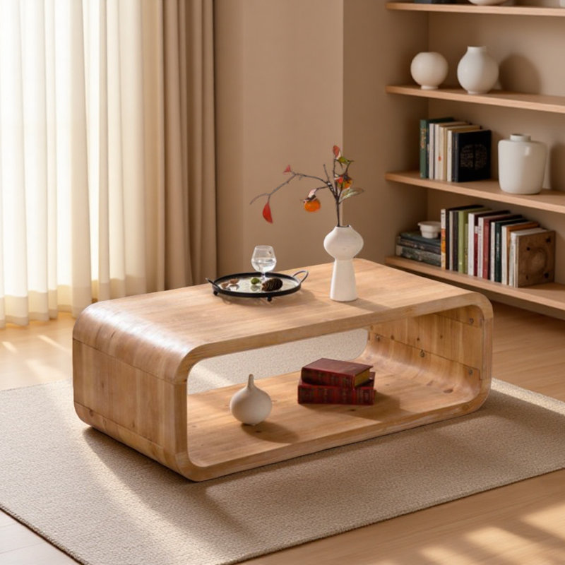 Table basse moderne en bois clair incurvé moderne avec cadre ouvert et rangement ouvert pour les salons contemporains