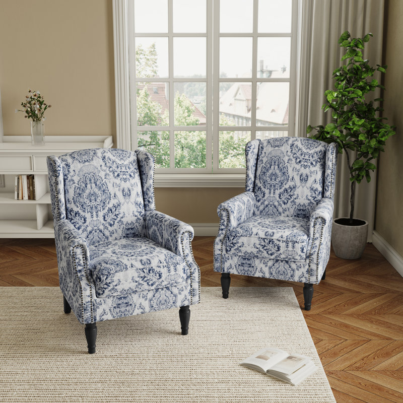 Fauteuil à oreilles tapissier à motif floral damassé bleu marine Duward avec garniture cloutée, Bleu marine damas