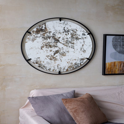 Miroir avec design rond et cadre industriel en métal
