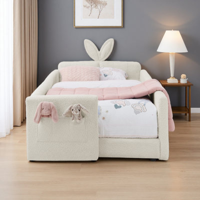 Lit plateforme tapissier simple avec tête de lit en forme d'oreille de lapin mignon, avec barrière de sécurité et poche