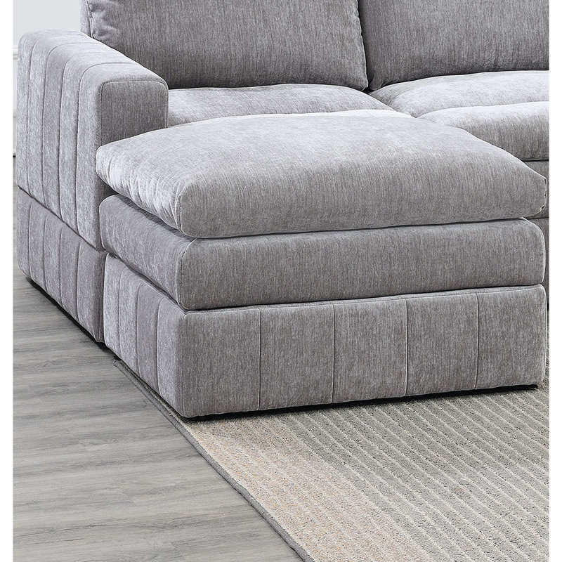 Canapé d'angle modulaire de 5 pièces en suède pour un espace de vie confortable et élégant. Tissu d'ameublement.