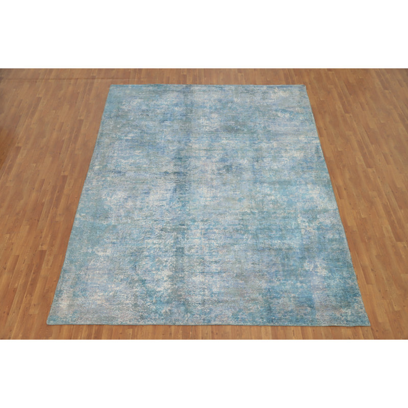 Tapis bleu à aspect délavé abstrait 9 x 11
