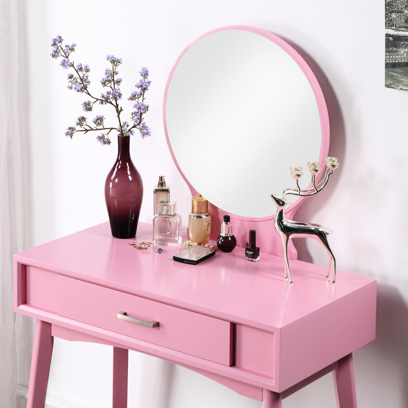 Coiffeuse et tabouret en bois rose avec rangement fonctionnel. Style chic, matériaux contemporains et design tendance.