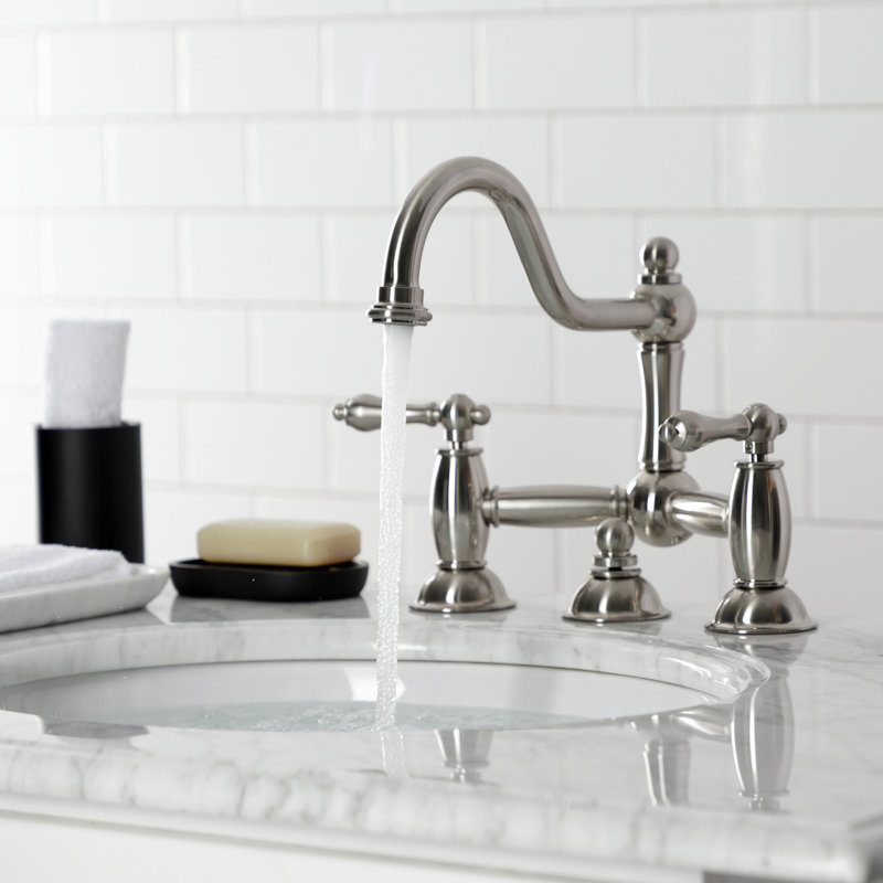 Kingston Brass Restoration Two-Handle 3-Hole Deck Mount Bridge Bathroom Faucet with Brass Pop-Up, Satin Nickel