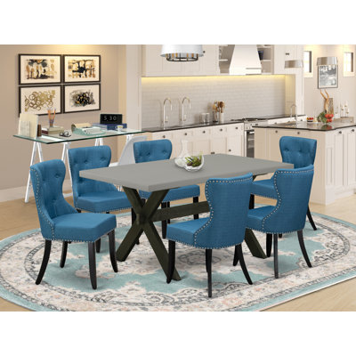 Ensemble de table de salle à manger 7 pièces comprenant une table de salle à manger rectangulaire avec pieds en X et 6 chaises Parson rembourrées en tissu bleu, finition noire brossée