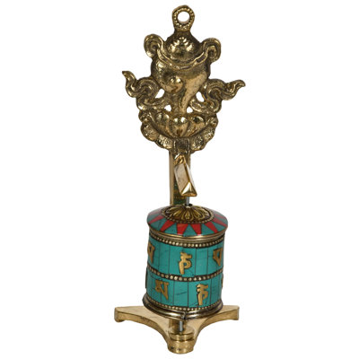 Sculpture d'une roue de prière bouddhiste tibétaine avec conque (Ashtamangala)