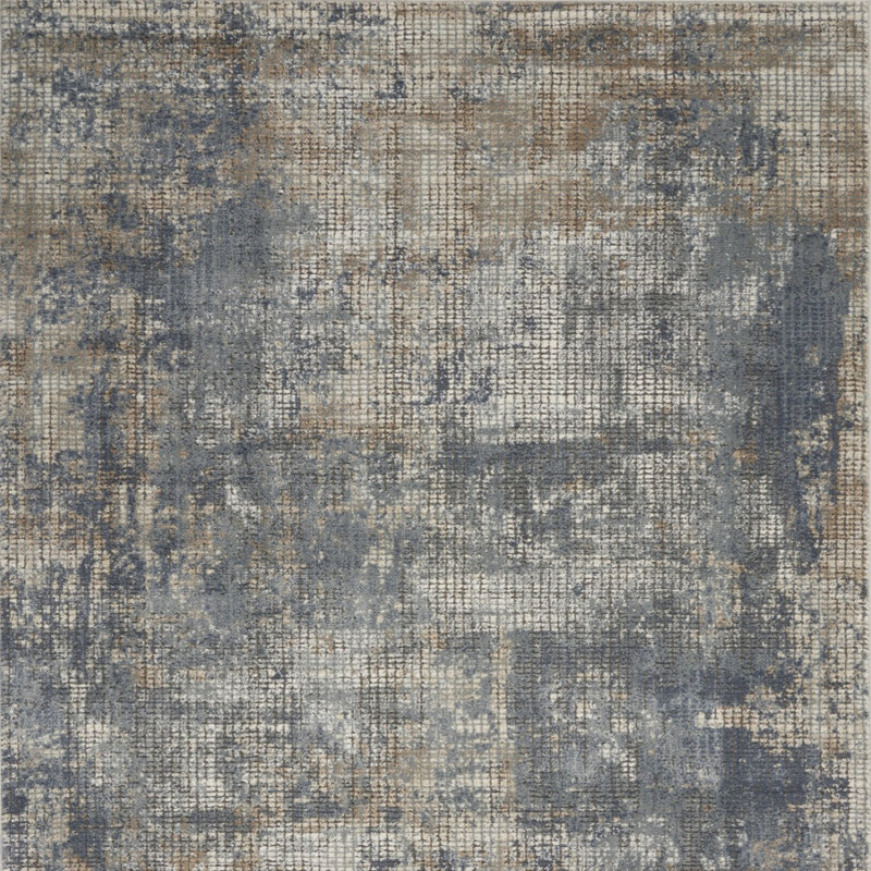 Tapis bleu et beige 4 pi x 6 pi à motif abstrait tissé à la machine