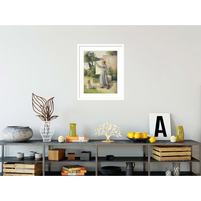 «Woman Hanging up the Washing» par Camille Pissarro - Impression Giclée sur cadre