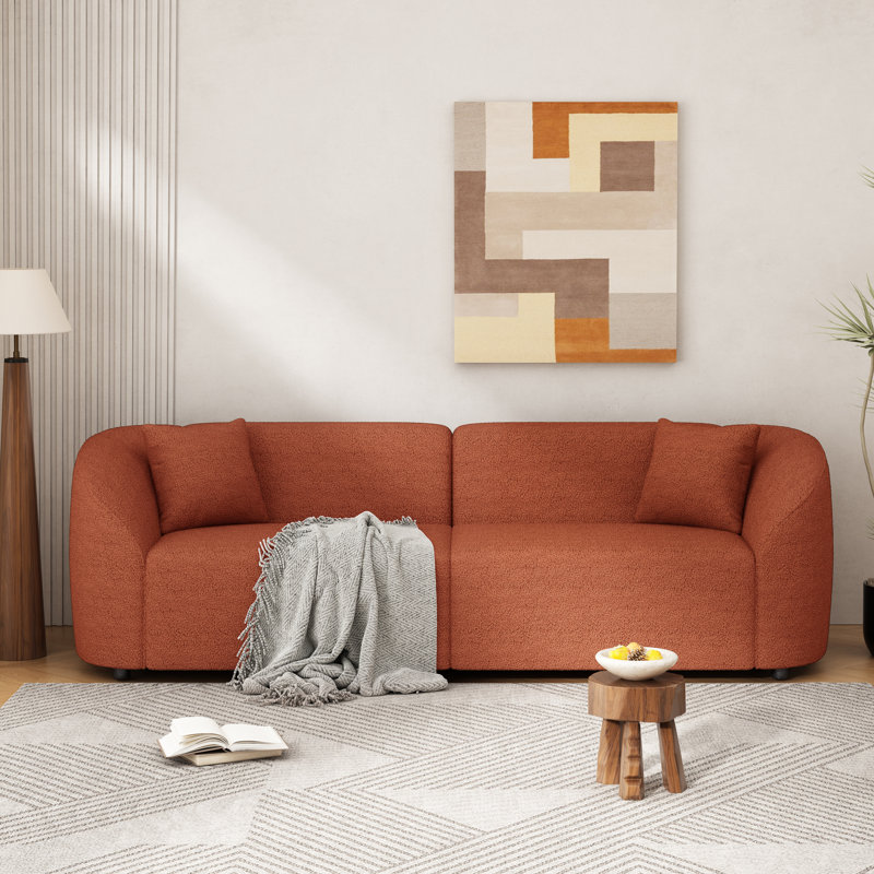 Canapé incurvé contemporain à conception épurée avec structure durable, Boucle orange