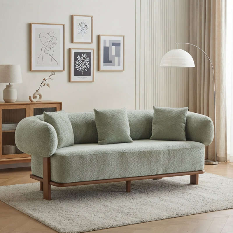 Canapé à accoudoirs arrondis avec design ergonomique et support confortable, parfait pour les décors modernes et Mid-Century.