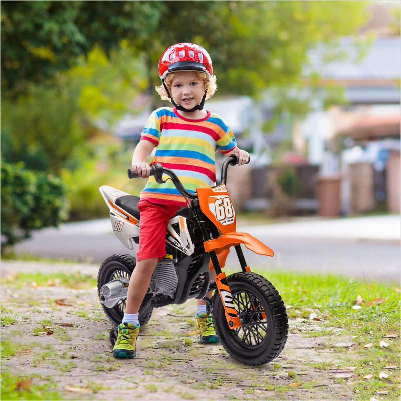 Moto électrique pour enfants avec roues d'entraînement et suspension arrière en orange riche