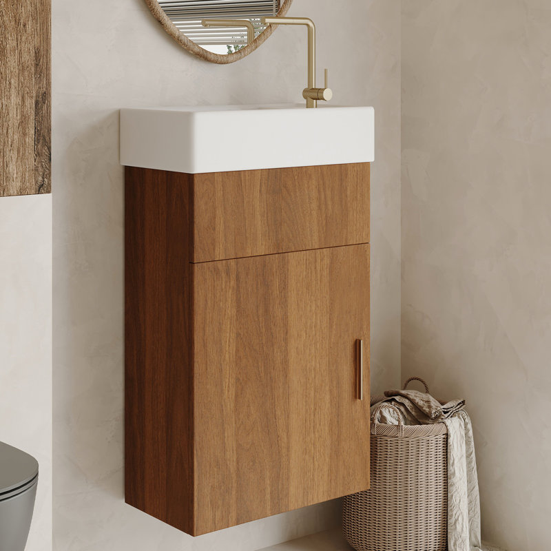 Meuble-lavabo suspendu de 42 cm (16,5 pouces) avec lavabo en céramique, porte et bonde réglable, idéal pour les petits espaces. Style moderne du milieu du siècle, rangement intégré, fermeture amortie.
