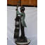 Grand garçon jouant du violoncelle en bronze - Dimensions: L 19 po x l 22 po x H 59 po.