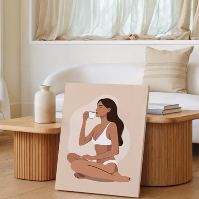 Reproduction d'art sur toile représentant une femme sereine assise en tailleur sur une surface aux tons neutres et doux exsudant une impression d'art sur toile