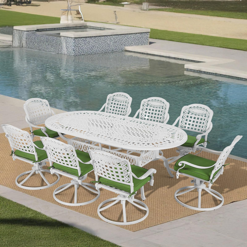 L'ensemble de salle à manger d'extérieur 9 pièces Foundry Select, l'ensemble de conversation en aluminium coulé résistant aux intempéries, comprend 8 chaises berçantes pivotantes et une table ovale avec trou pour parasol, coussin blanc / vert