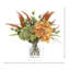 Arrangement d'hortensias et de bruyères dans un vase en verre