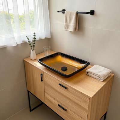 Vasque à poser en verre trempé dégradé or ambré de 56 x 36 cm avec bonde escamotable.