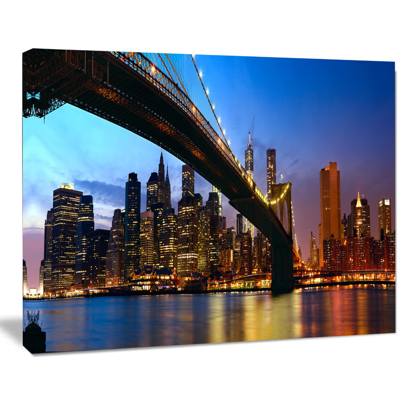 Manhattan Cityscape with Bridge Under Blue Sky Canvas Print