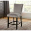Ensemble de salle à manger transitionnel 7 pièces avec table rectangulaire en marbre et 6 chaises hautes rembourrées à dossier plein, garnies de clous décoratifs, disponibles en blanc, gris ou noir. Différentes combinaisons de couleurs.