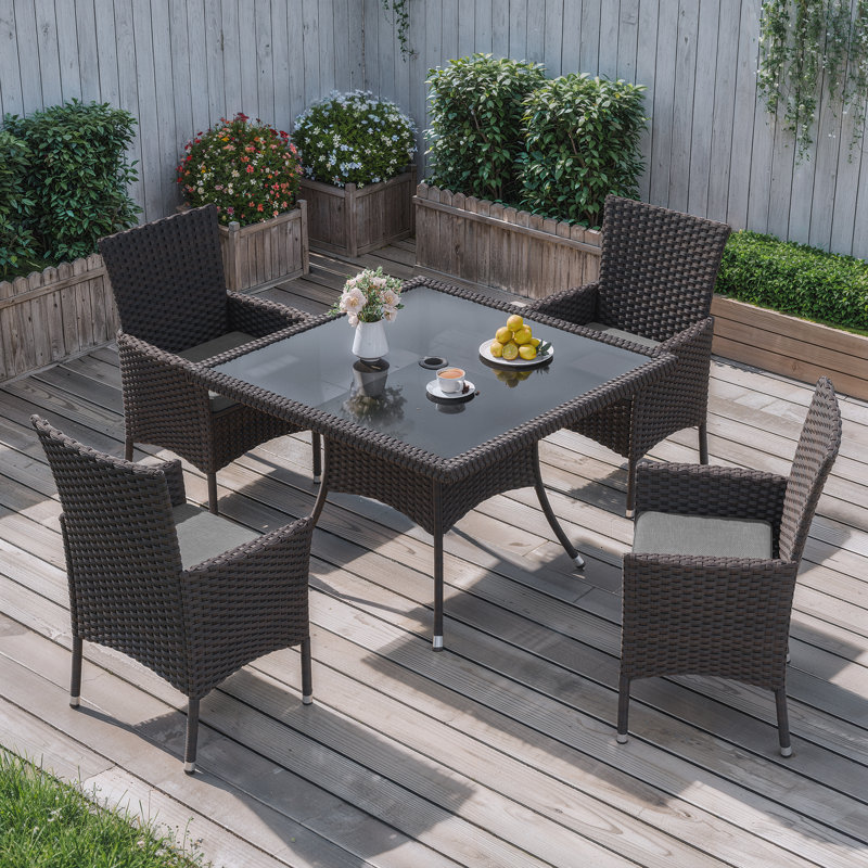 Ensemble repas en rotin 5 pièces avec coussins, fauteuils et table en verre, Gris