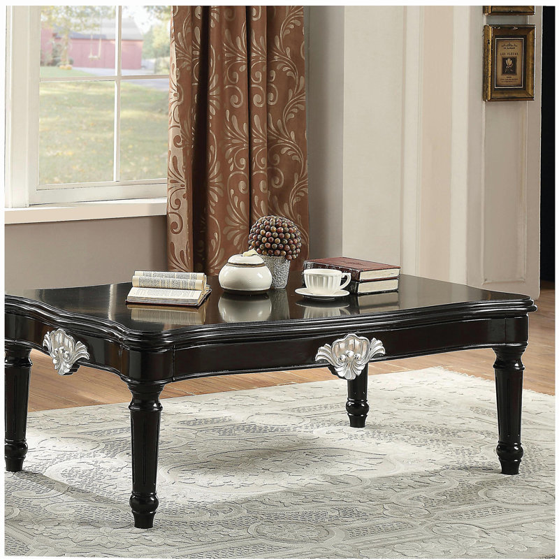 Table basse noire à pieds rotatifs