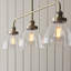 Anais 3lt Linear Pendant light finished in Ant. Brass