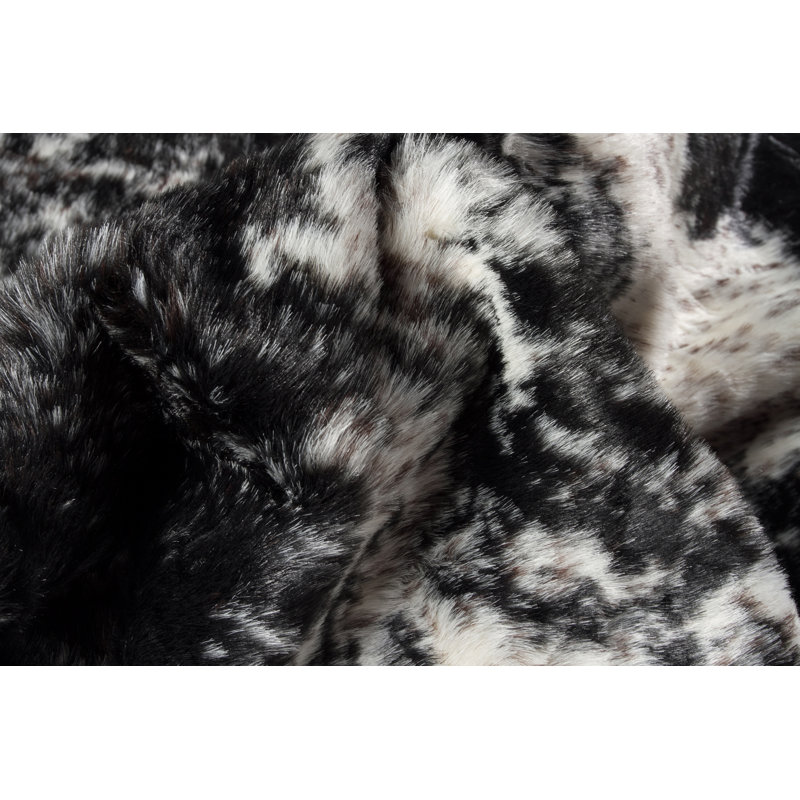 Novelty Loewen Animal Print Faux Sheepskin Area Rug in Black/White, 4.25' x 5' 