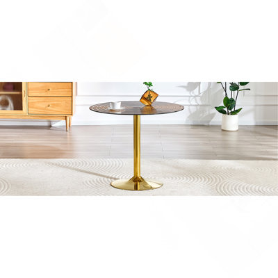 Table ronde en verre brun clair de 35 pouces de diamètre. Pilier en métal doré. Négociation, table basse de maison, table de salle à manger. Convient aux petits espaces repas de 2 à 4 personnes.