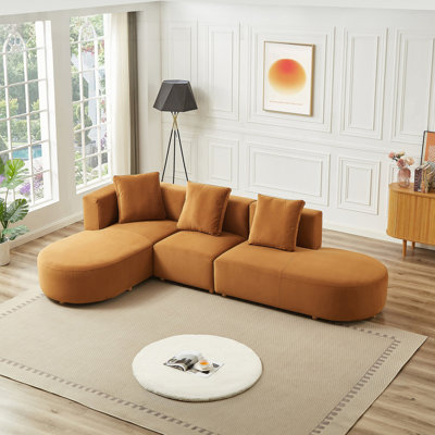 Canapé modulaire en velours avec design incurvé