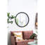 Le miroir mural de salon en métal à cadre perlé ajoute du style de chambre à coucher