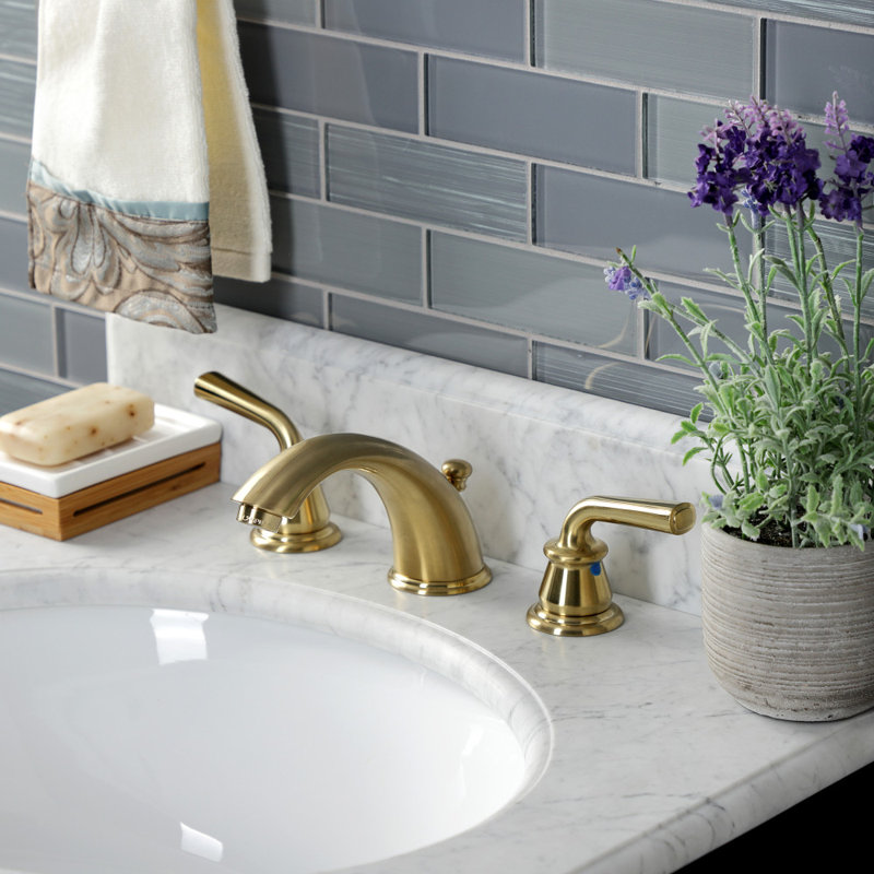Kingston Brass Restoration Two-Handle 3-Hole Deck Mount Widespread Bathroom Faucet with Retail Pop-Up Drain, Brushed Brass