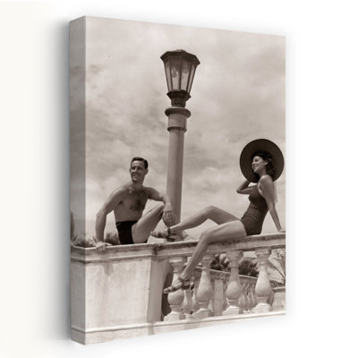 1930S 1940S Man Woman Sun Hat Couple Bathing Suits Sitting On Balustrade Wall Tropical Vacation Hotel Miami Beach Florida Usa Abstract Contemporary...