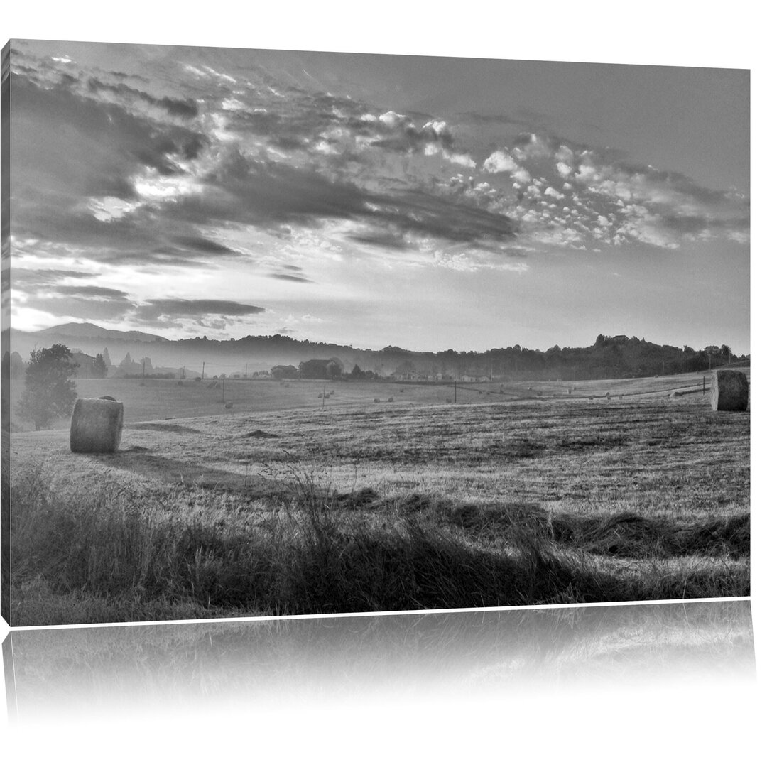 Leinwandbild Feld mit Heuballen