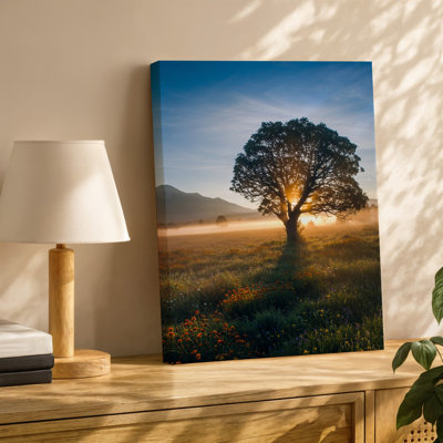Canvas A Majestic Solitary Tree Stands Prominently In The Foreground Its Wall Art Branches Sprawling Wide Against A Breathtaking Canvas Wall Art
