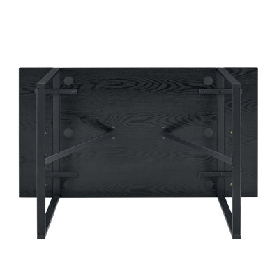 A 55-Inch minimalist retro rectangular dining table with a black textured top with Inset Rectangular Black Metal legs.Minimalist MDF Tabletop.Meeting