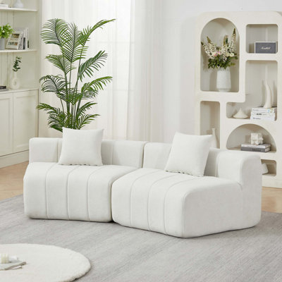 Canapé courbé modulaire en chenille avec coussins pour une utilisation multi-espace