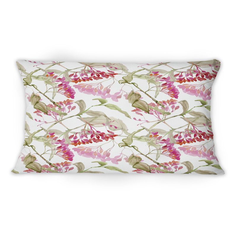 Coussin décoratif à motif de fleurs rouges et de feuilles vertes sur fond blanc