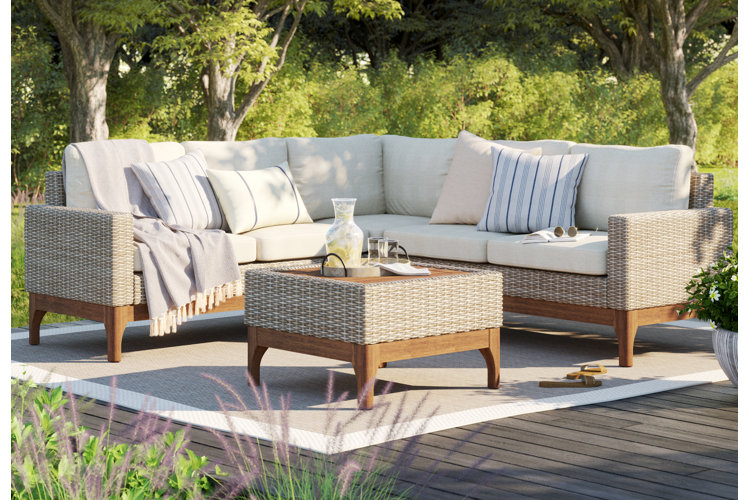 Wicker sectional with striped pillows