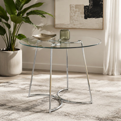 Table de salle à manger contemporaine en chrome avec plateau en verre transparent