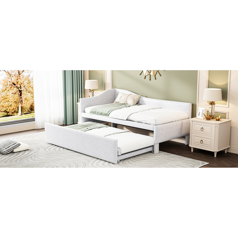 Lit de jour simple rembourré en L beige avec lit gigogne escamotable, idéal pour le salon
