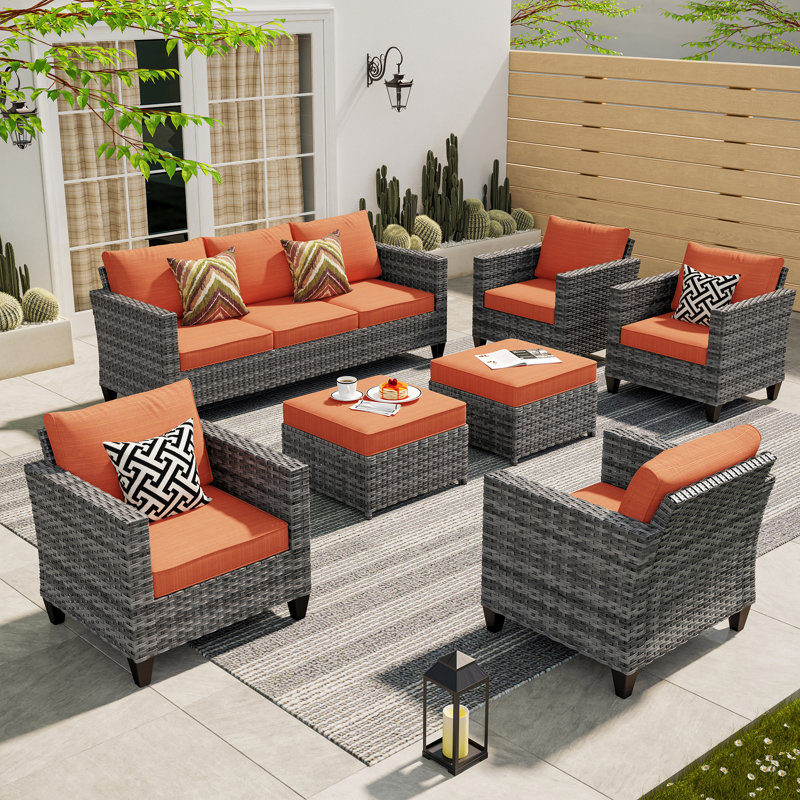 Ensemble de mobilier de patio en osier / rotin Amerissa 7 personnes, canapé d'extérieur avec canapé, chaises, repose-pieds et coussins confortables